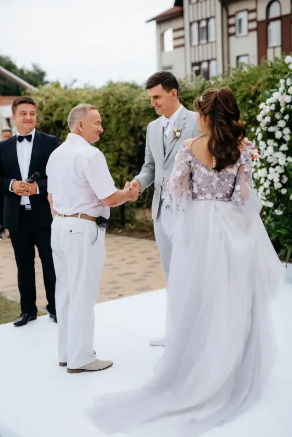 Bride walking into church with her father on wedding day