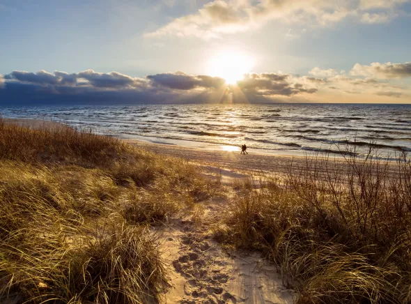 Sandy beach and dunes by the Baltic Sea in Poland at sunset