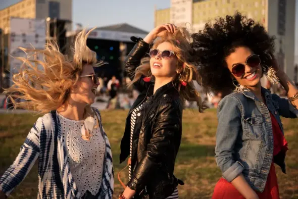 Three girls having a great time at a festival in Poland 