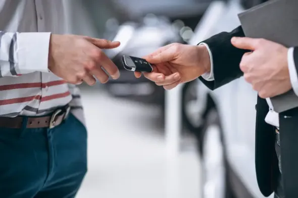 female hands close-up with car keys