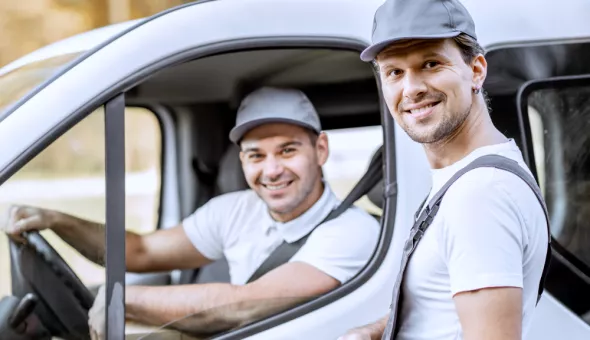 Two workers in a car 