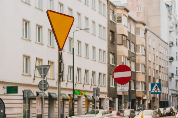 City street in Poland showing traffic regulations and road signs