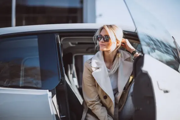 Traveller collecting a rental car at Warsaw Airport before a day trip