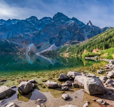 Colorful autumn sunrise over a lake in the Tatra Mountains