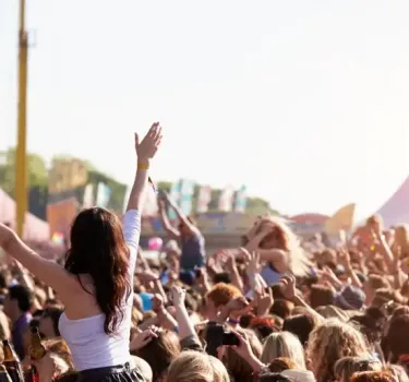 Crowds enjoying themselves outdoor music festival in Poland