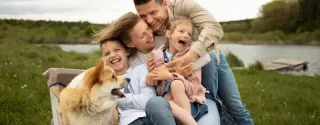 Happy family spending time outdoors on a family road trip in Poland