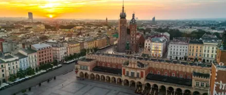 Central Market Square in Kraków at dawn in summer, the perfect starting point for exploring southern Poland by car
