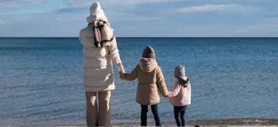 Mother with children during winter holidays at the seaside