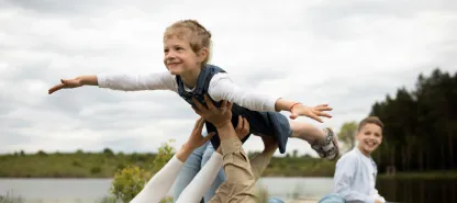 Happy family enjoying nature during a road trip in Poland